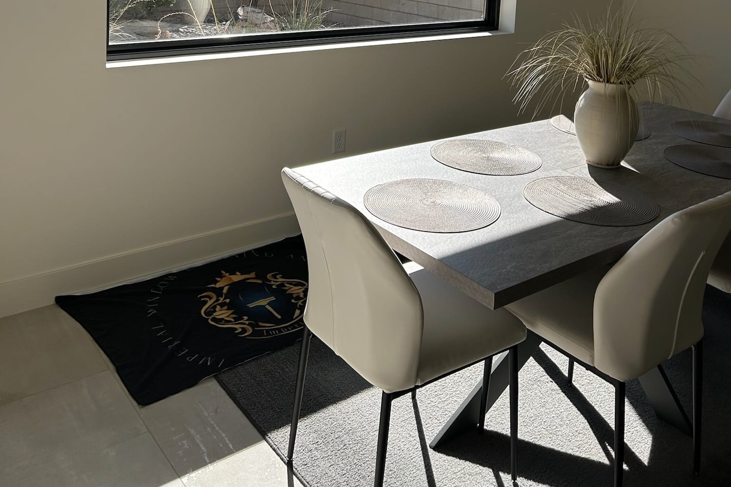 Dining room with a clean picture window and an Imperial floor mat protecting the floor