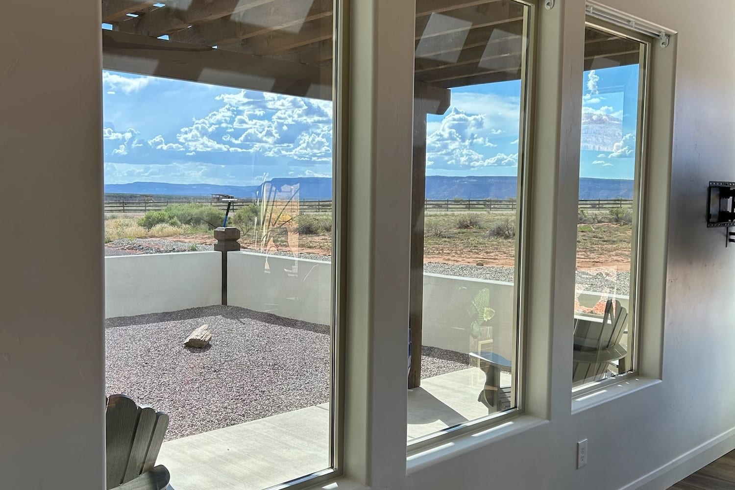 Clean picture windows in a Southern Utah home framing an open desert view