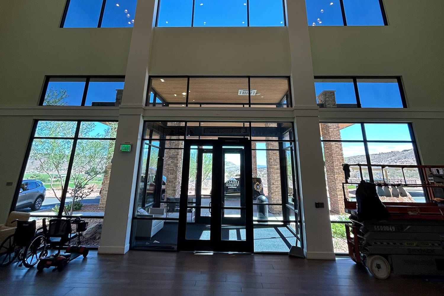 Two-story commercial lobby in St. George with full-height entry glass and clerestory windows above