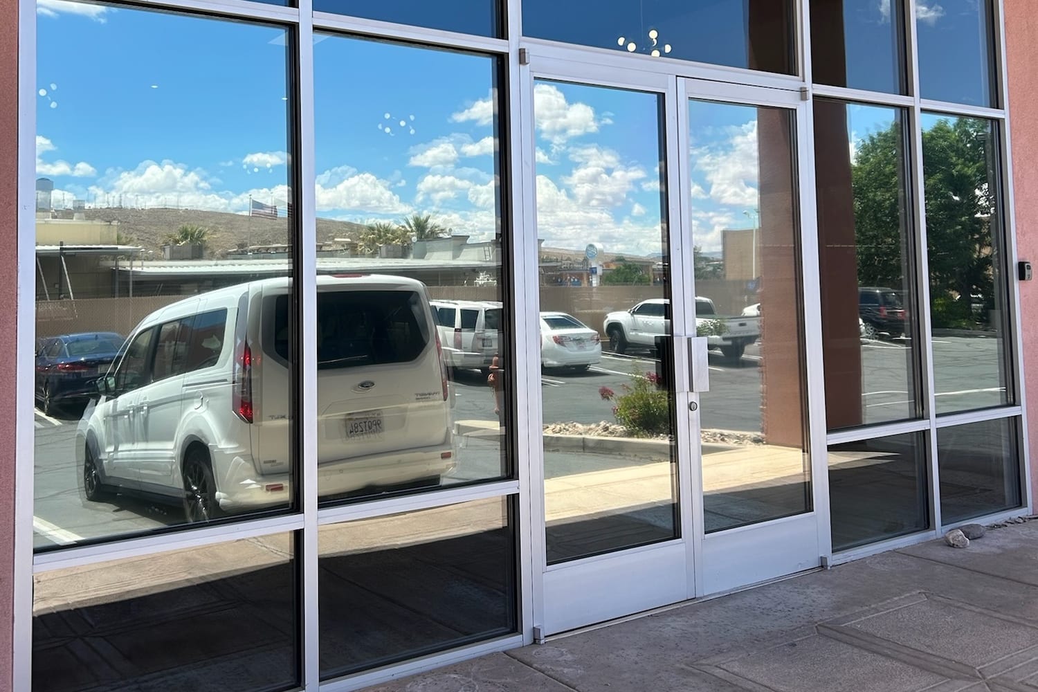 Clean commercial storefront entry glass in St. George
